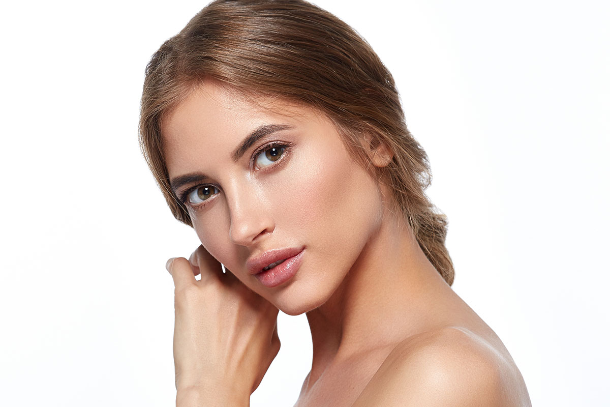 Young woman with lip filler from Aesthetic Envy in Sacramento.