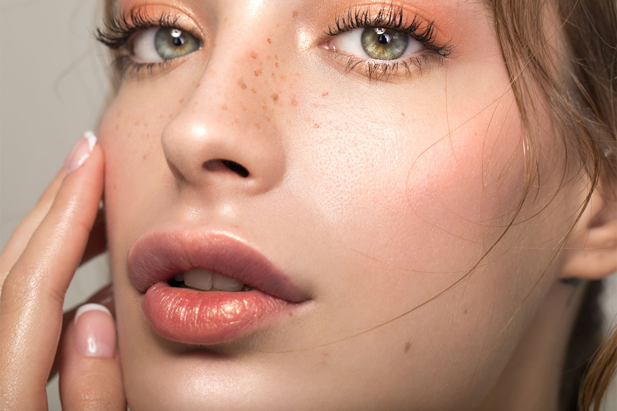 A woman's full lips after lip filler in Sacramento.